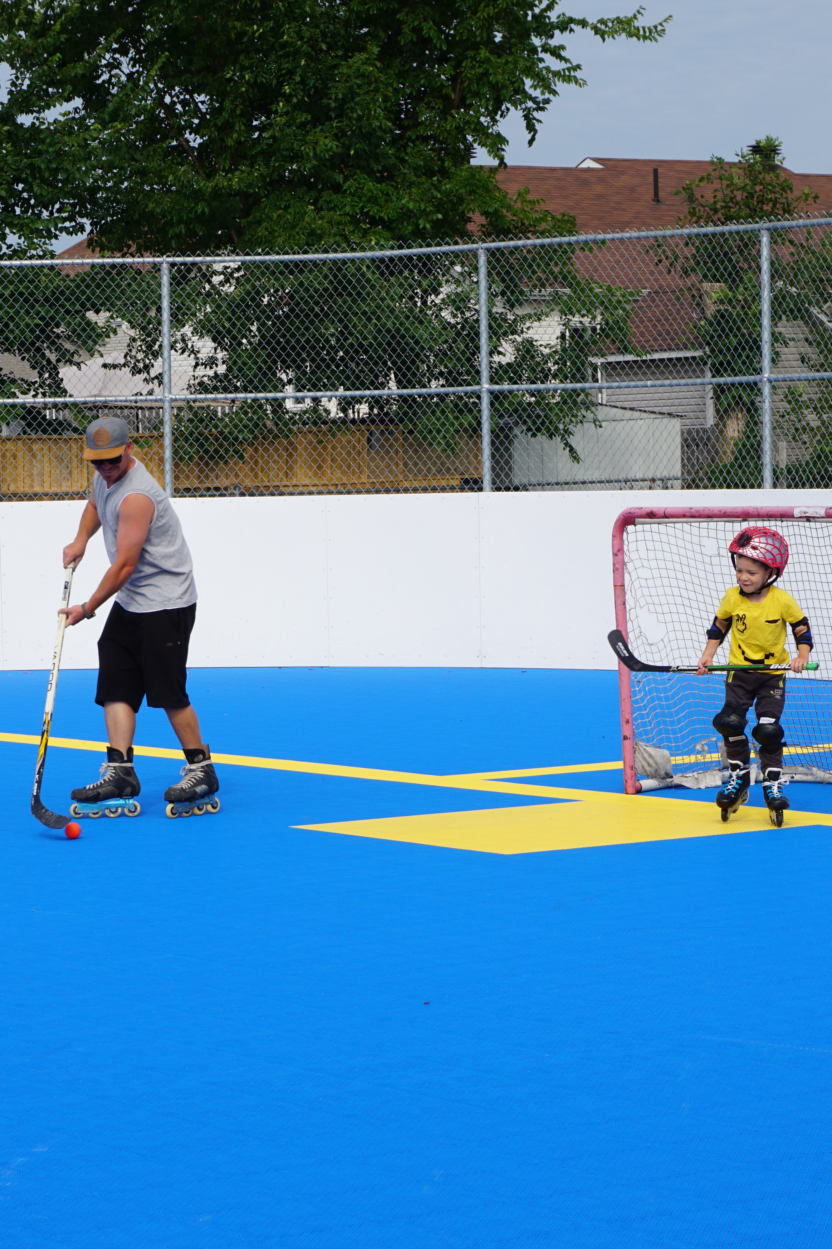 father and son playing dekhockey
