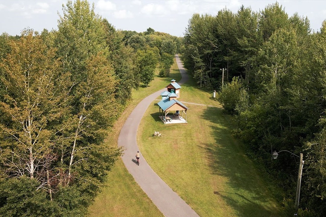 View of the recreation trail with a washroom and a gazebo.