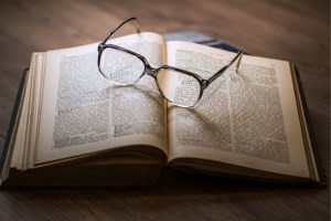 book with glasses