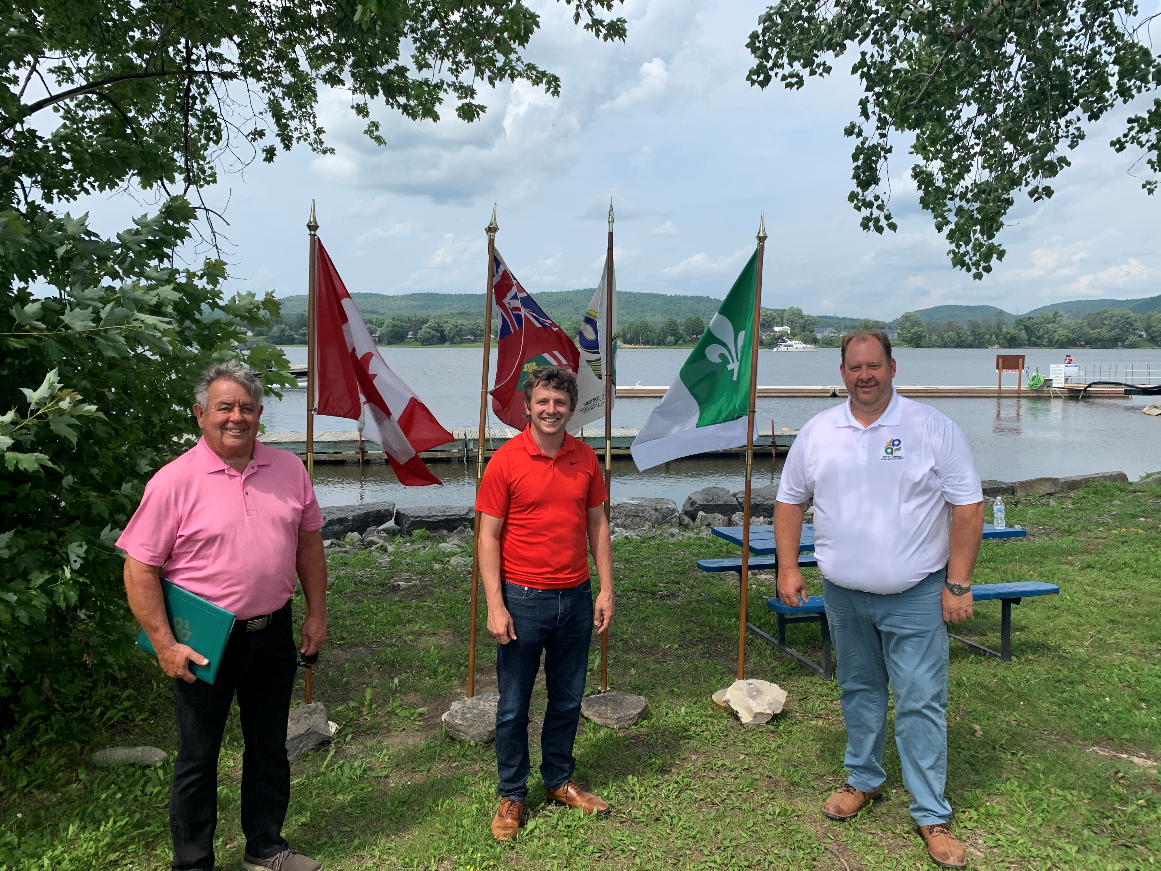 Pictured from left to right: Municipal councillor Yves Laviolette, Liberal MP Francis Drouin, Township of Alfred and Plantagenet Mayor Stephane Sarrazin with the Ottawa River in the background, on an overcast day.