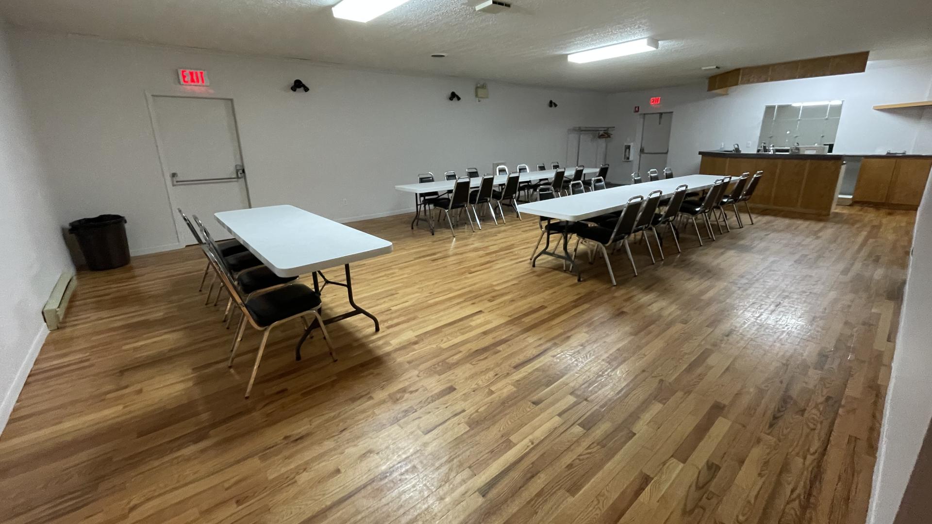 Small hall with 3 tables and chairs