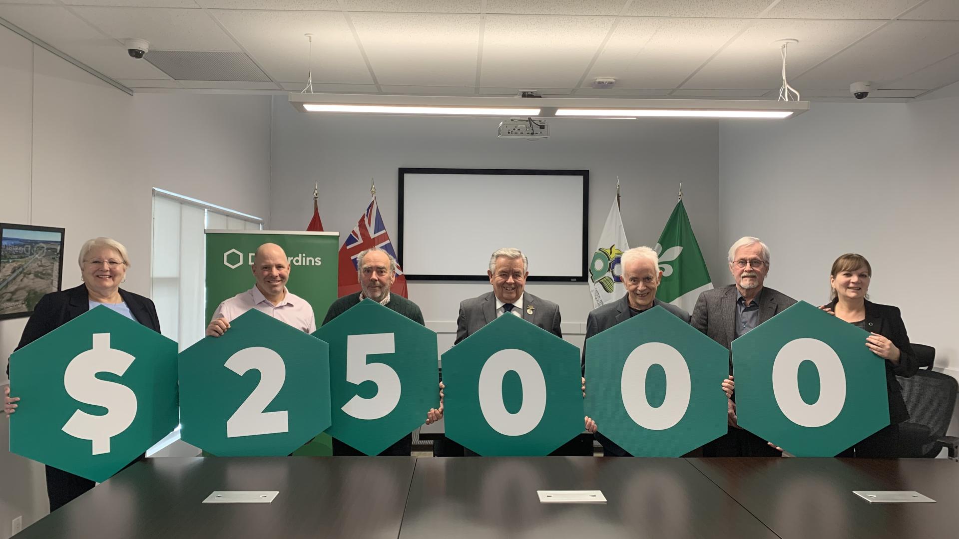 Council receiving donation from Desjardins