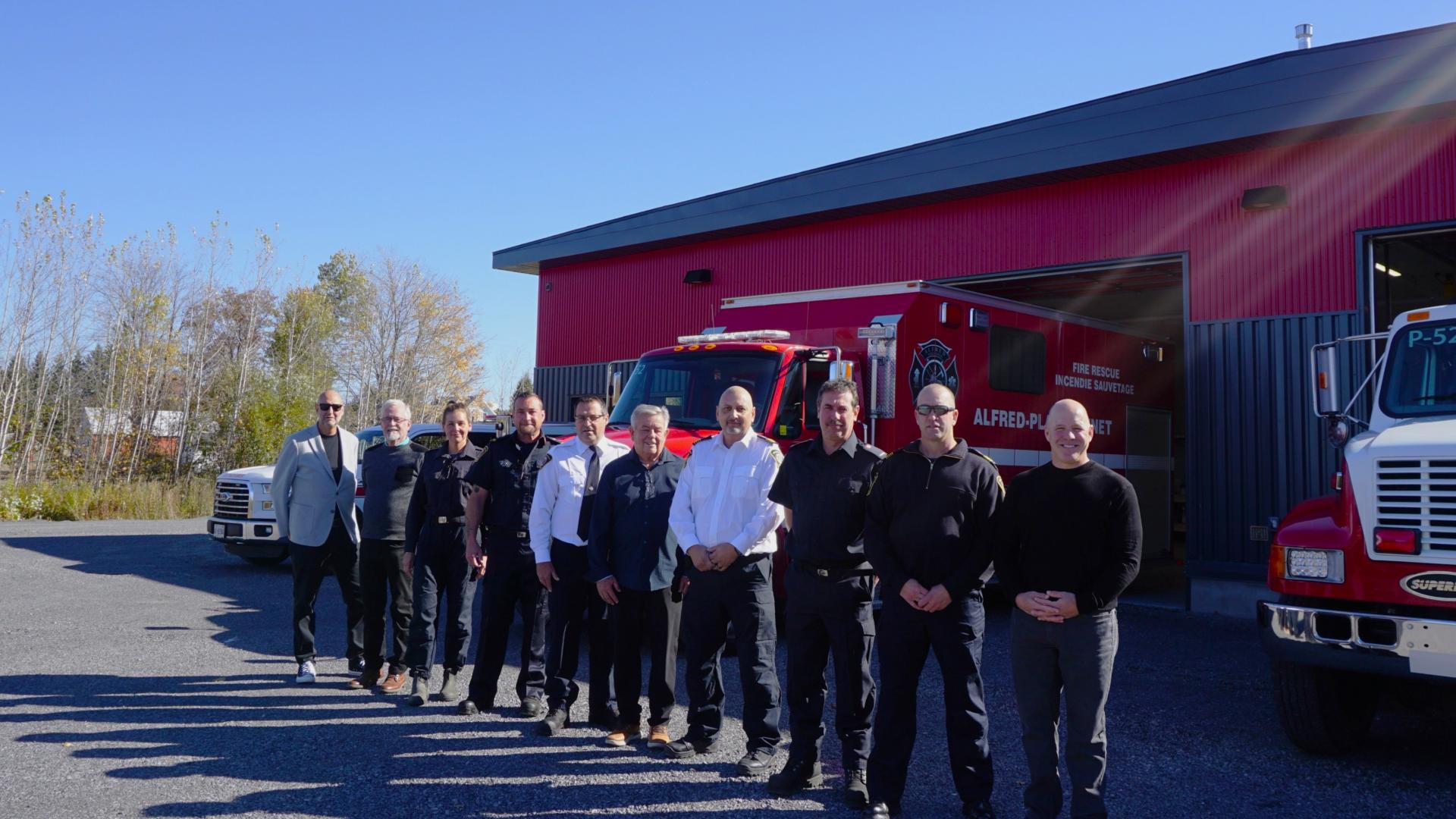 Members of the Fire Department and Township administration standing in front of the new Alfred Fire Station.