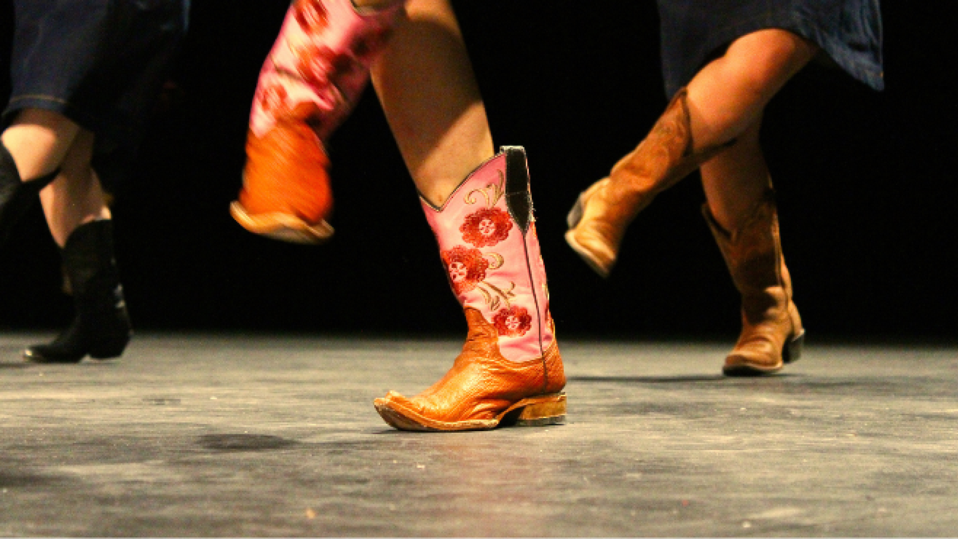 Group of people line dancing