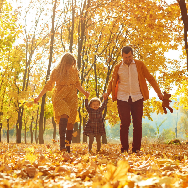 Familly of 3 in a forest during Fall