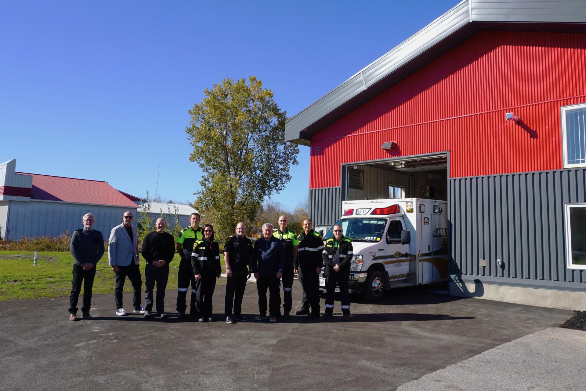 Members of the United Counties of Prescott and Russell Emergency Services and Township administration standing in front of the new Alfred Fire Station.